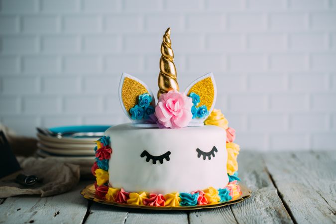 Cute unicorn cake with painted closed eyes