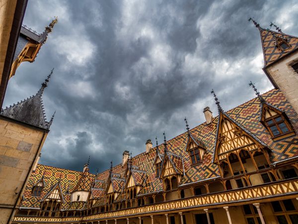Empty streets of the medieval city of Beaune in Burgundy. The stormy sky