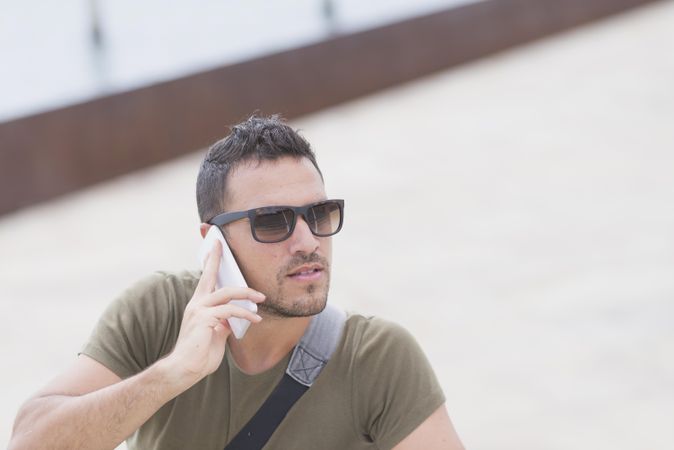 Male talking on cellphone, copy space
