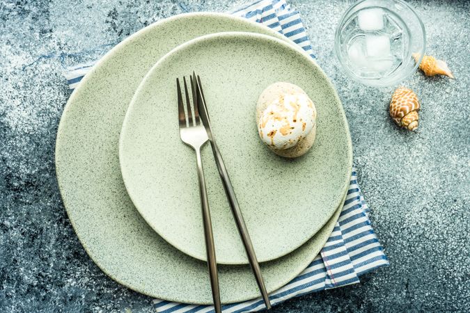 Top view of coastal table setting with sea stars and shells