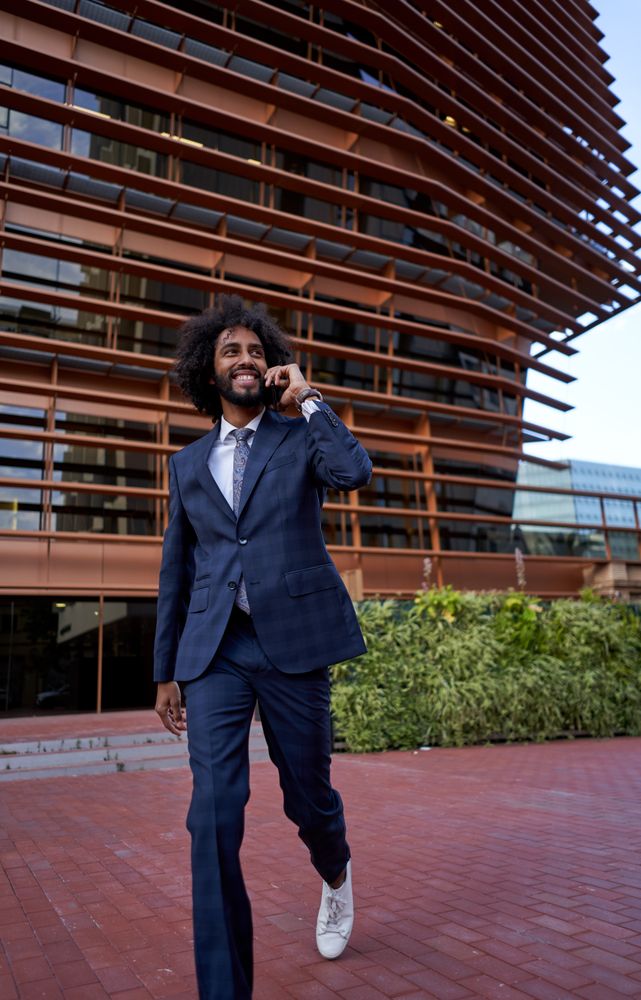 smiling businessman talking on smartphone