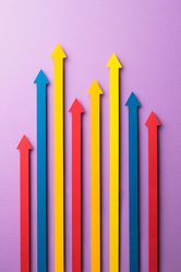 Colorful paper arrows pointing in the same direction in different lengths
