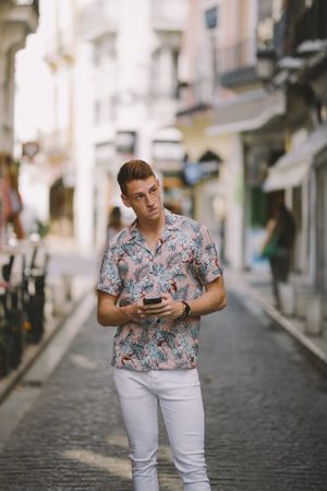 Man standing on the street on the mobile phone