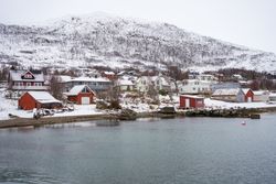 Picturesque town in calm lake in winter