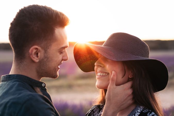 Couple in love in a lavender field at sunset