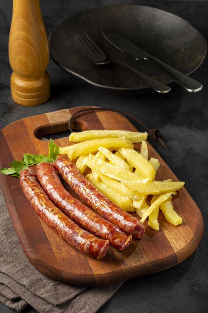 Grilled German sausage with french fries.