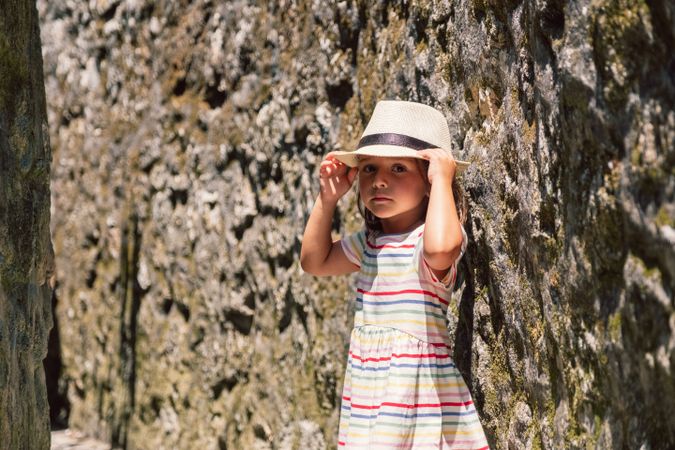 Girl in narrow stone walkway