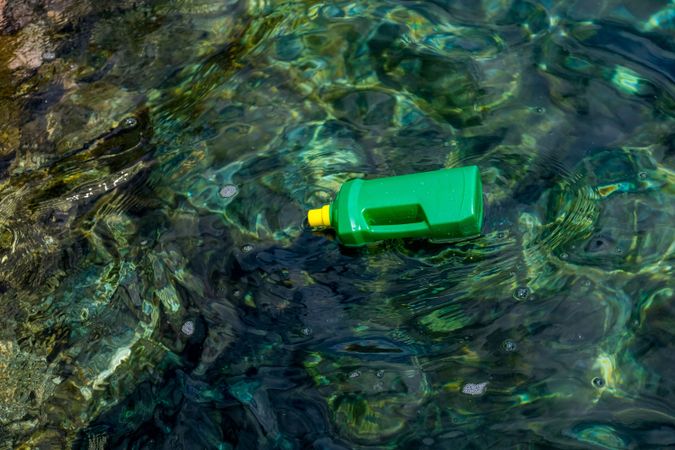 Plastic bottle floating on water