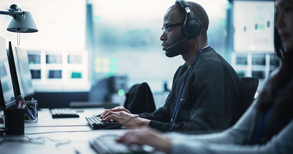 Black Specialist Working in Advanced Technology Industry