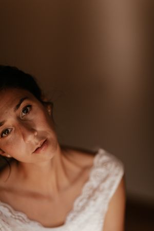 woman sitting in dark room