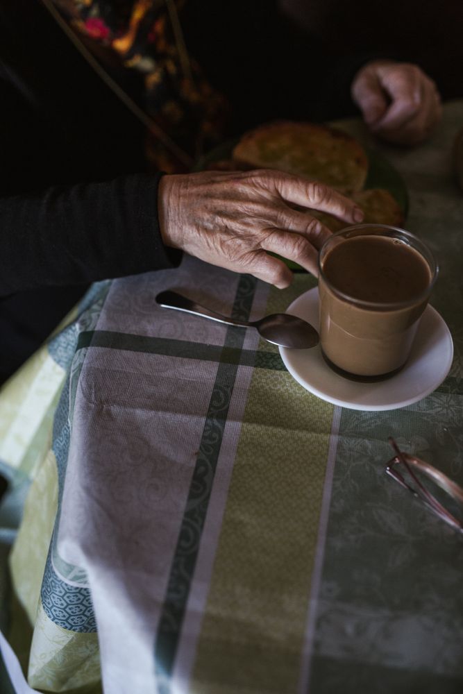 Mature anonymous woman having breakfast