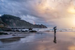 Man watching sunset on beach