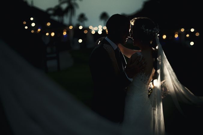 Marriage of woman and man embracing in darkness