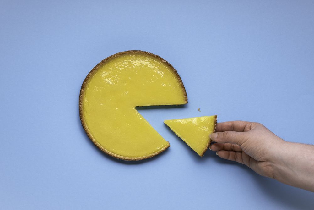 Taking a lemon pie slice