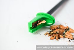 Green pencil sharpener with shavings & space for text 5kREo6