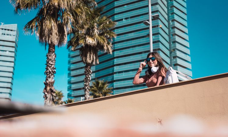 Teen girl watching the street while listening to music.