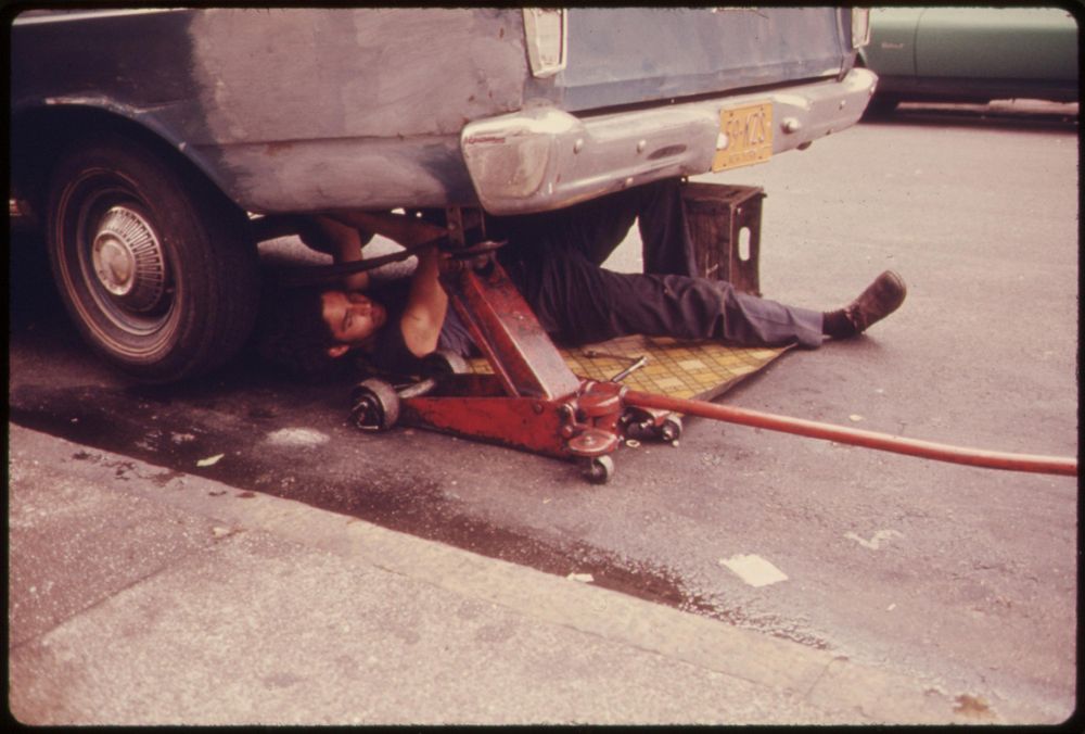 Man Working on Car in Hell's Kitchen, New York City