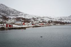 Picturesque town in calm lake in winter
