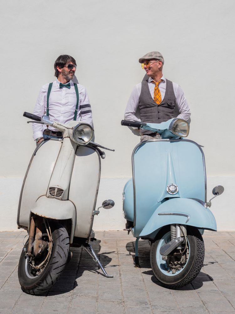 Trendy friends with vintage scooters
