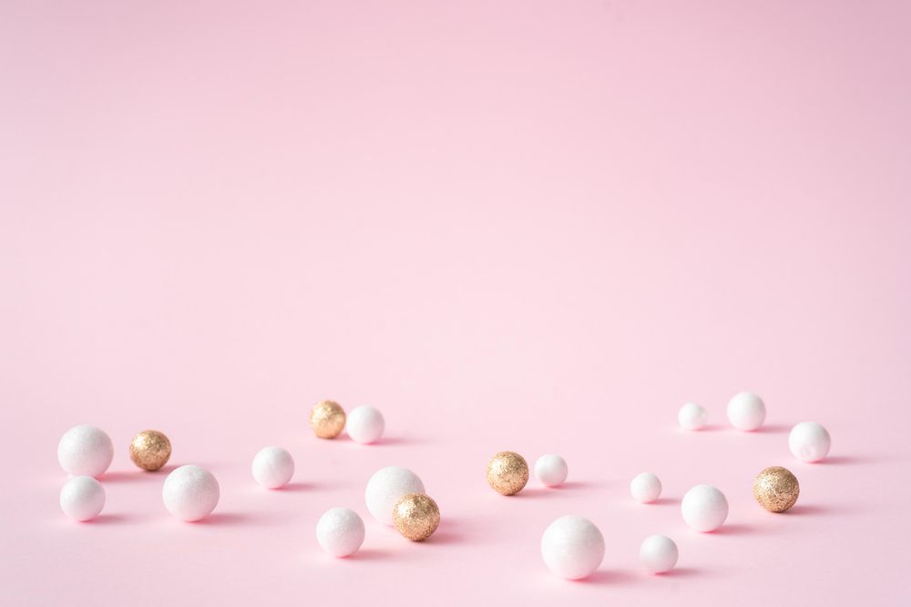 Pink copy space background with gold and glitter decorations