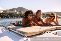 Beautiful young women relaxing on private yacht deck 43elj0