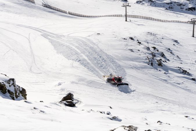 Shoveling snow in ski resort of Sierra Nevada in winter