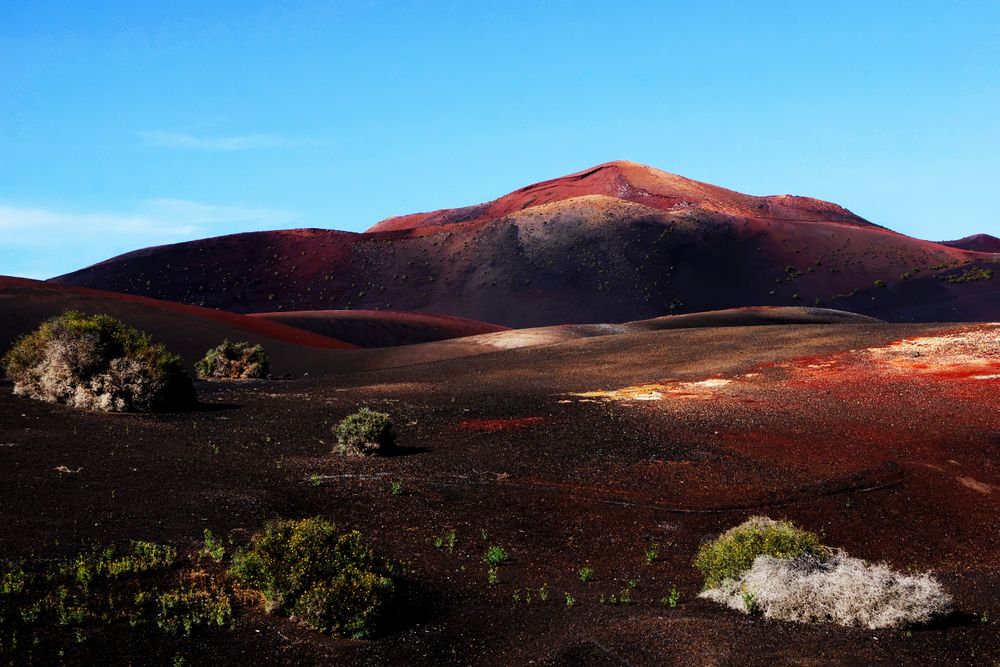 Picturesque view of volcanic terrain with solidified lava in wild area
