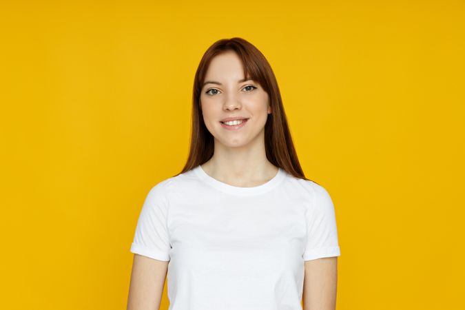 Concept of people, young woman on yellow background
