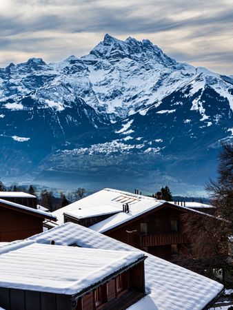 Swiss Alps winter landscape with snow and sun, mountains in Europe