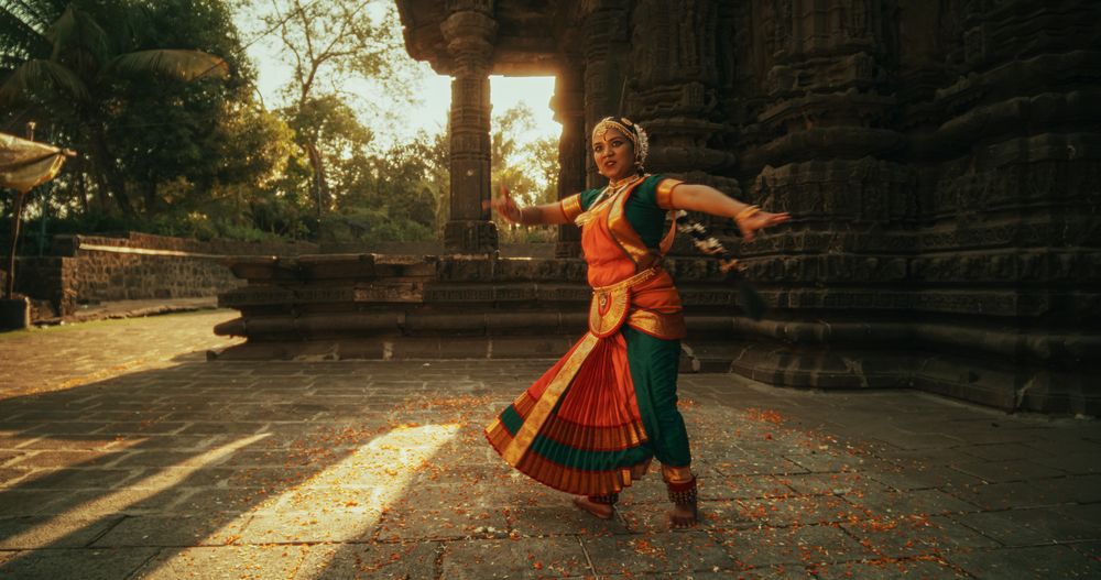 Female Indian Lead Dancer Explaining to her Team Dancers the Moves of a Traditional Choreography.