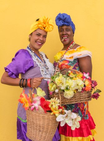 Havana, Cuba - November, 22 2012: Smiling Cuban women with flowers