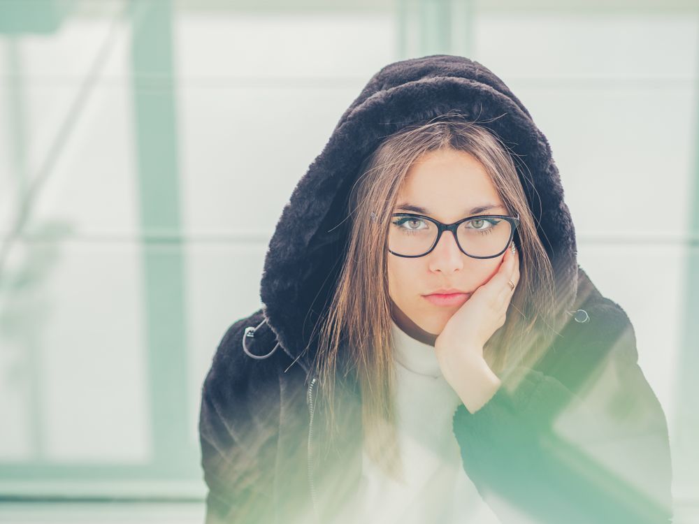 Young woman over a glasses ground
