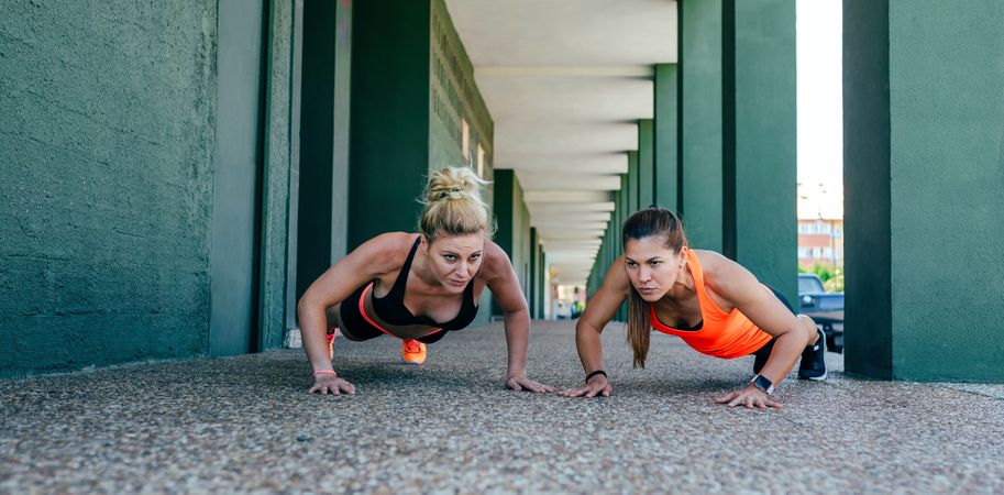 Sportswomen doing push-ups
