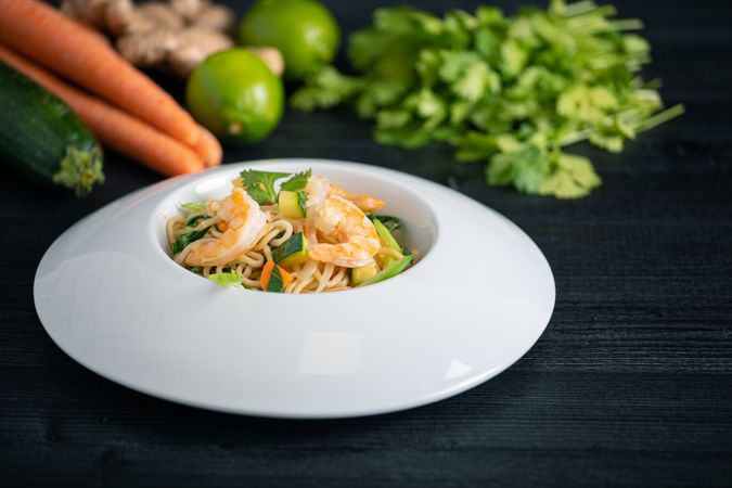 Tasty Pad Thai of vegetables and prawns in plate