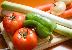 Fresh vegetables on cutting board in the kitchen