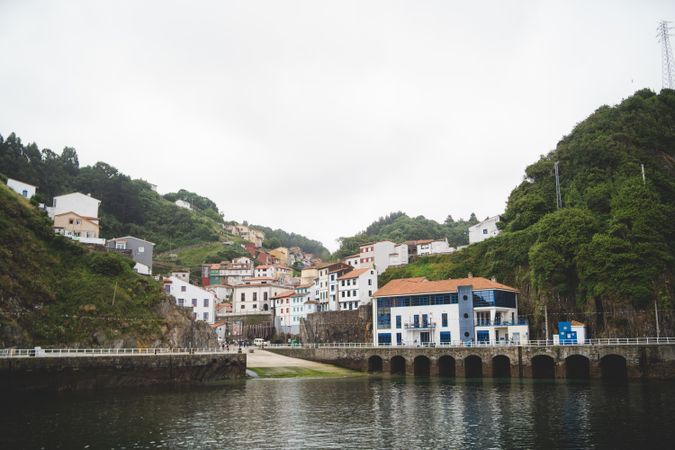 Townscape with houses on hills near water