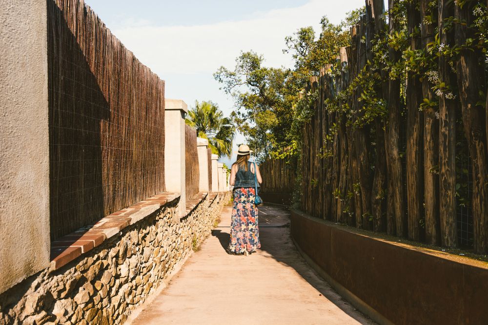 Woman walking in narrow path