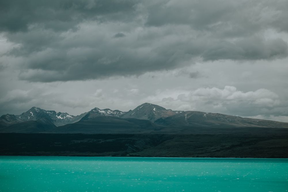 Sea coast with turquoise water and rocky mountains