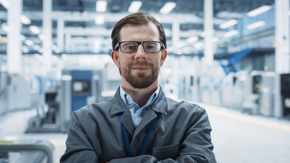 Portrait of happy male scientist in lab