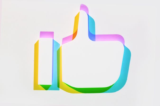 Multi-colored thumbs up like icon with shadow