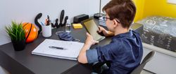 Teenager doing homework with a tablet