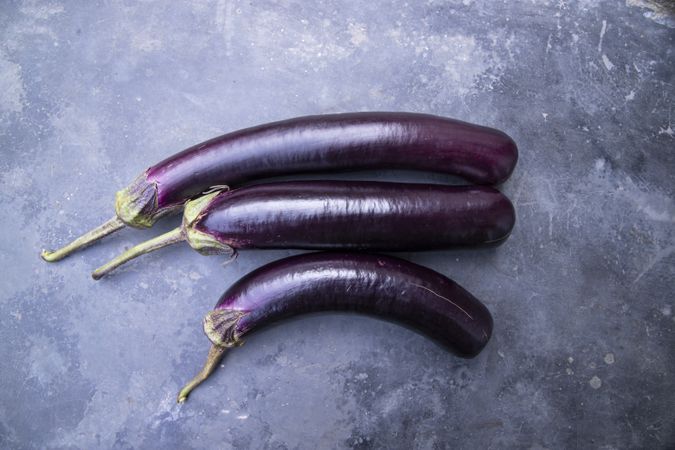 Fresh eggplant on a concrete Floor