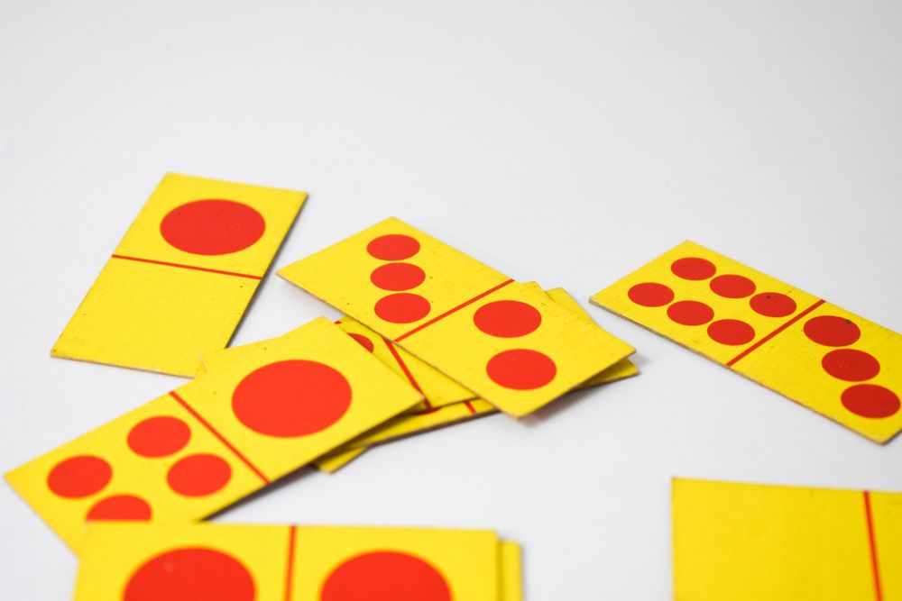 Domino cards scattered on table