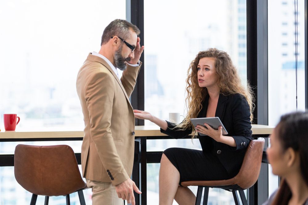 Two colleagues having a tense conversation