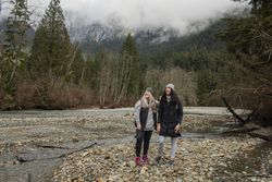 Two women looking up enjoying  mountain scenery