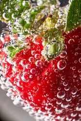 Fresh strawberry with transparent bubbles