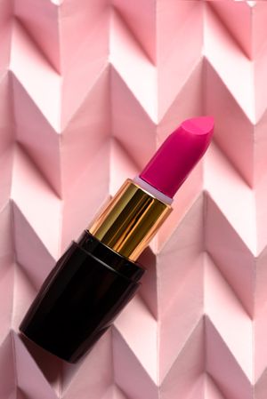 Lipstick on raised pink chevron. Product and make up concept