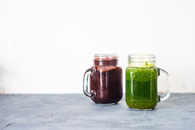 Purple and green smoothie on counter