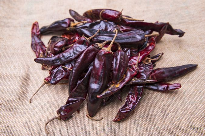 Some Dry Pepper or red chili on the brown jute fiber fabric