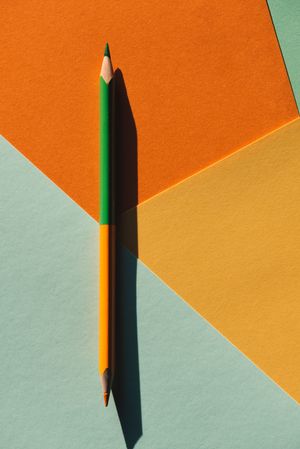 double-ended colored pencil on geometric  background
